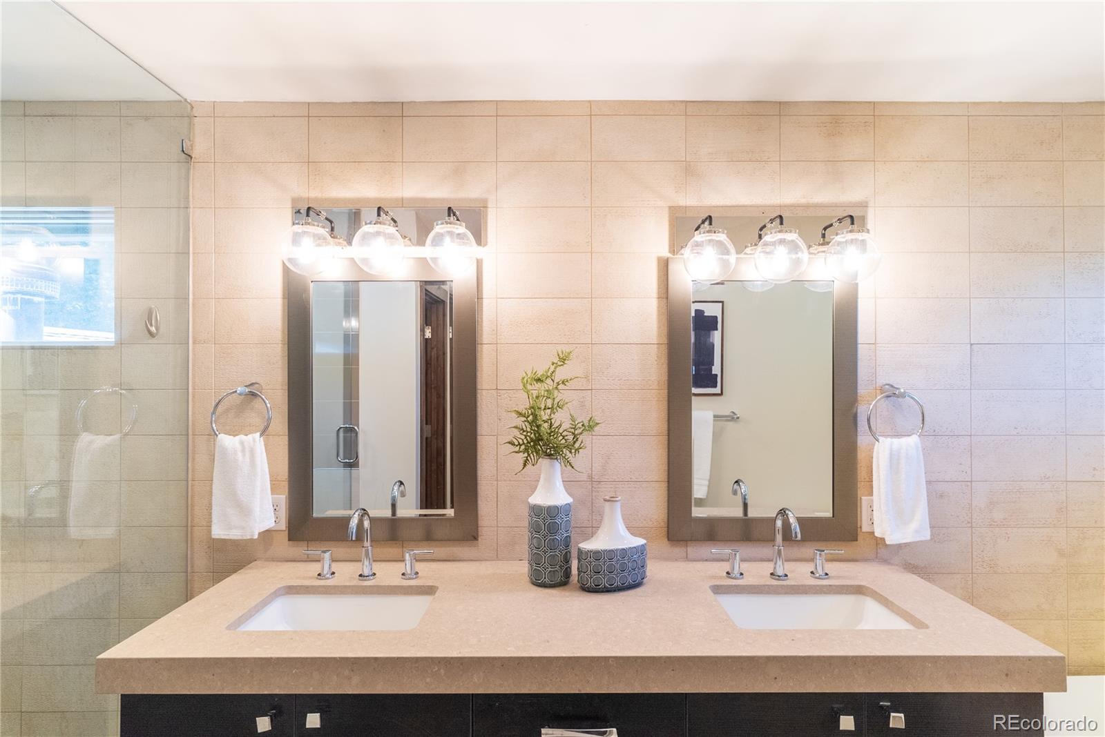 2464 Powderhorn Lane Boulder, CO 80305 - Photo 28 of 40 a bathroom with a sink and a mirror