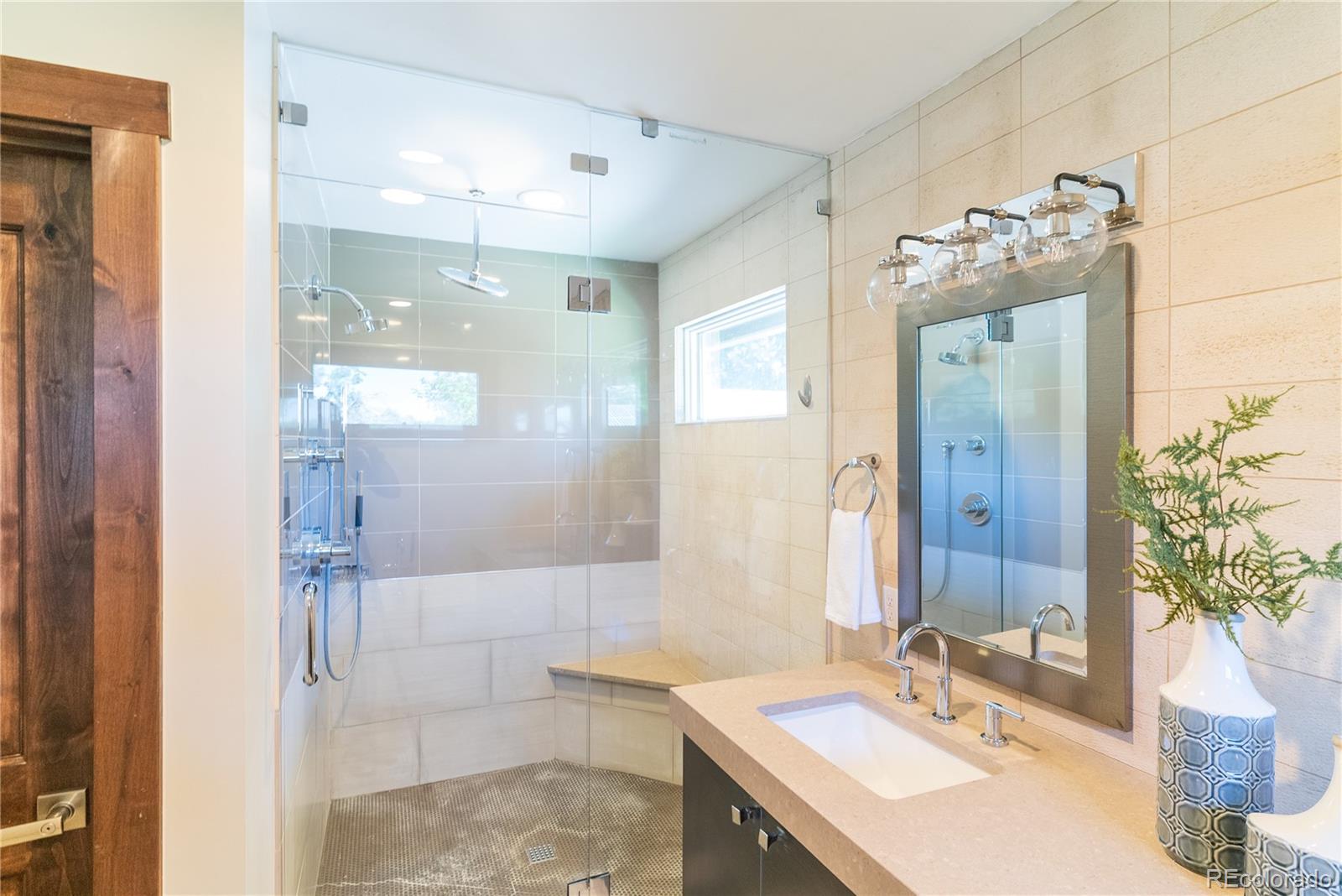 2464 Powderhorn Lane Boulder, CO 80305 - Photo 29 of 40 a bathroom with a sink and a mirror