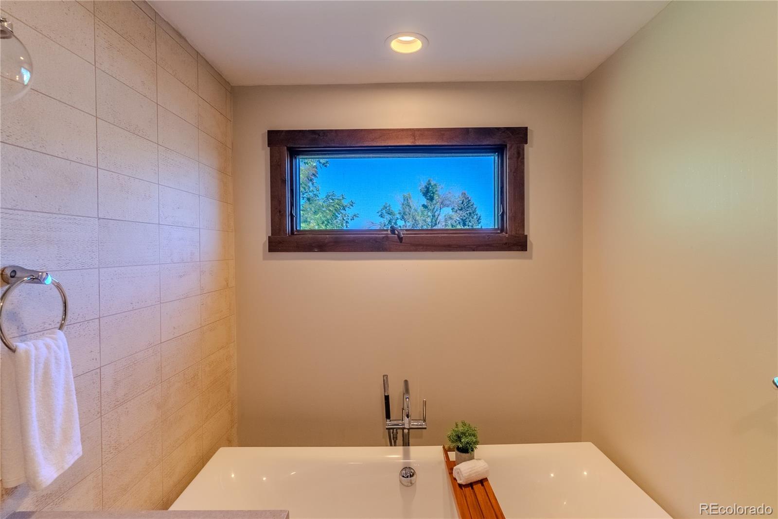 2464 Powderhorn Lane Boulder, CO 80305 - Photo 30 of 40 a bathroom with a toilet and a sink