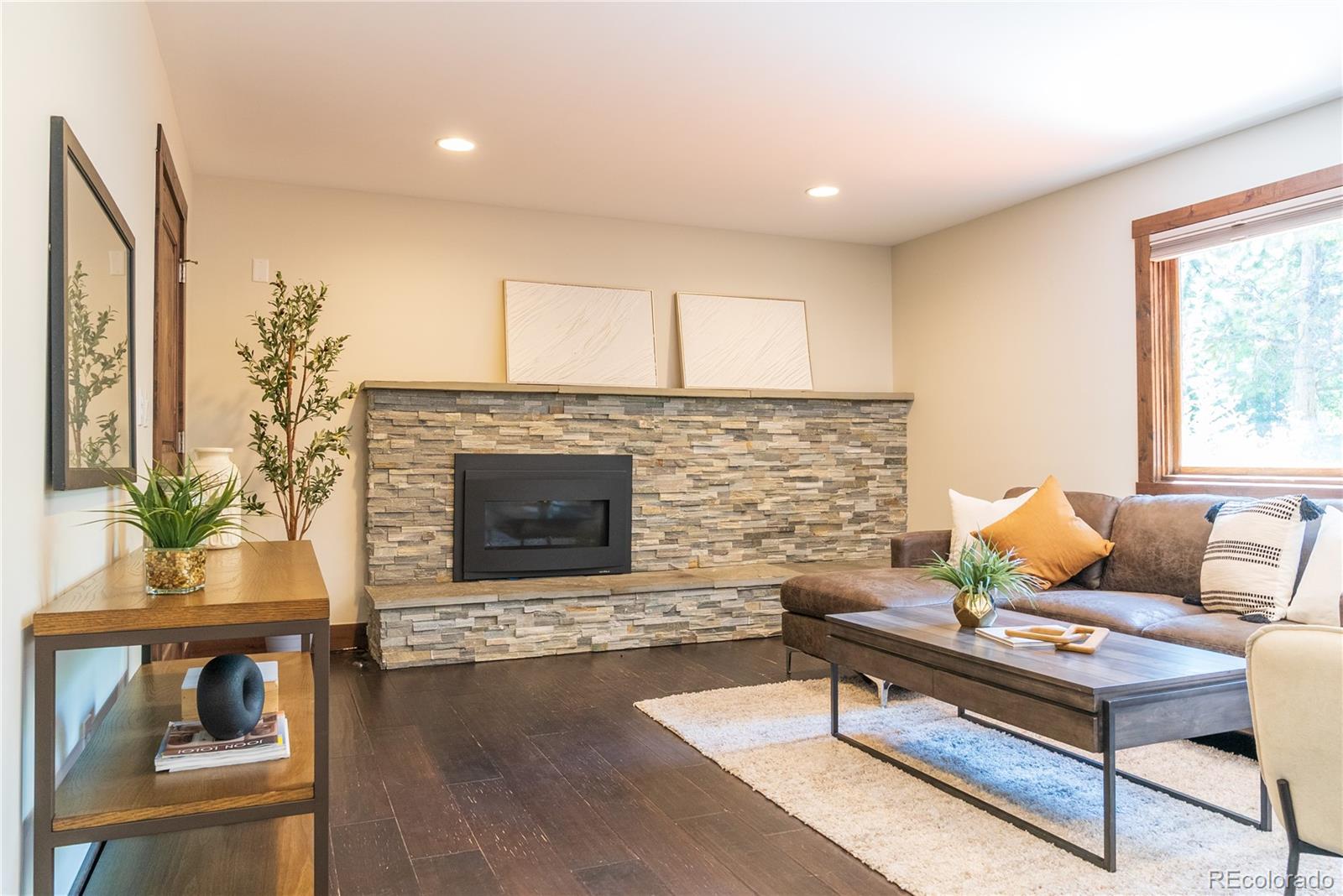 2464 Powderhorn Lane Boulder, CO 80305 - Photo 33 of 40 a living room with furniture and a fireplace