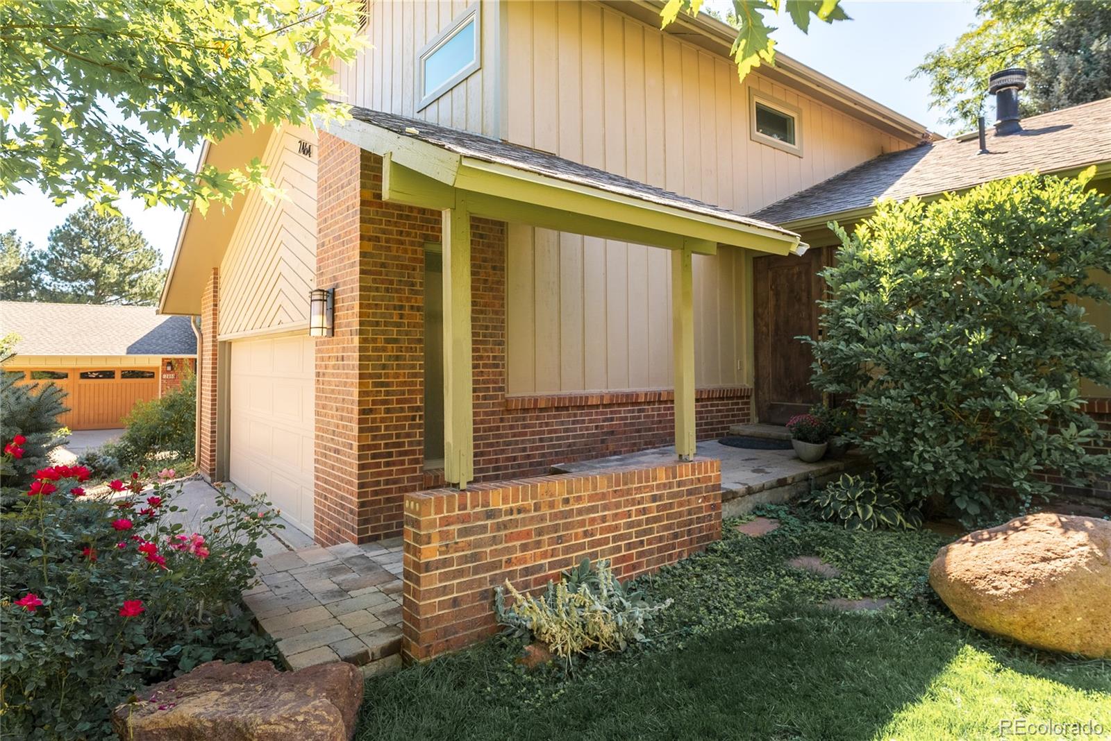 2464 Powderhorn Lane Boulder, CO 80305 - Photo 9 of 40 a front view of a house with a porch