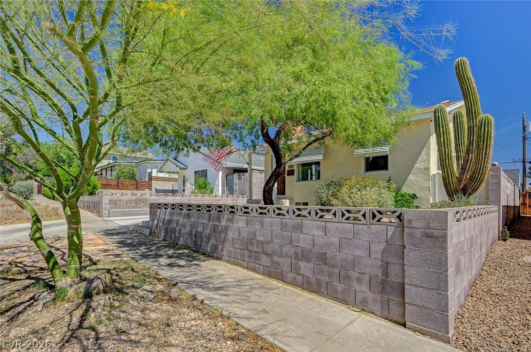 629 L Avenue Boulder City, NV 89005 - Photo 3 of 46 View of property hidden behind natural elements featuring stucco siding