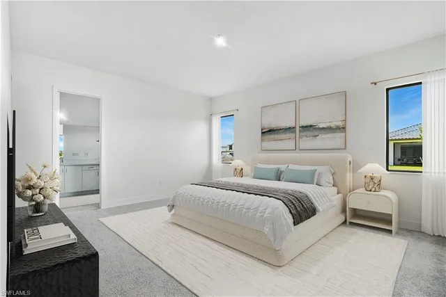 a bedroom with a bed and a couch