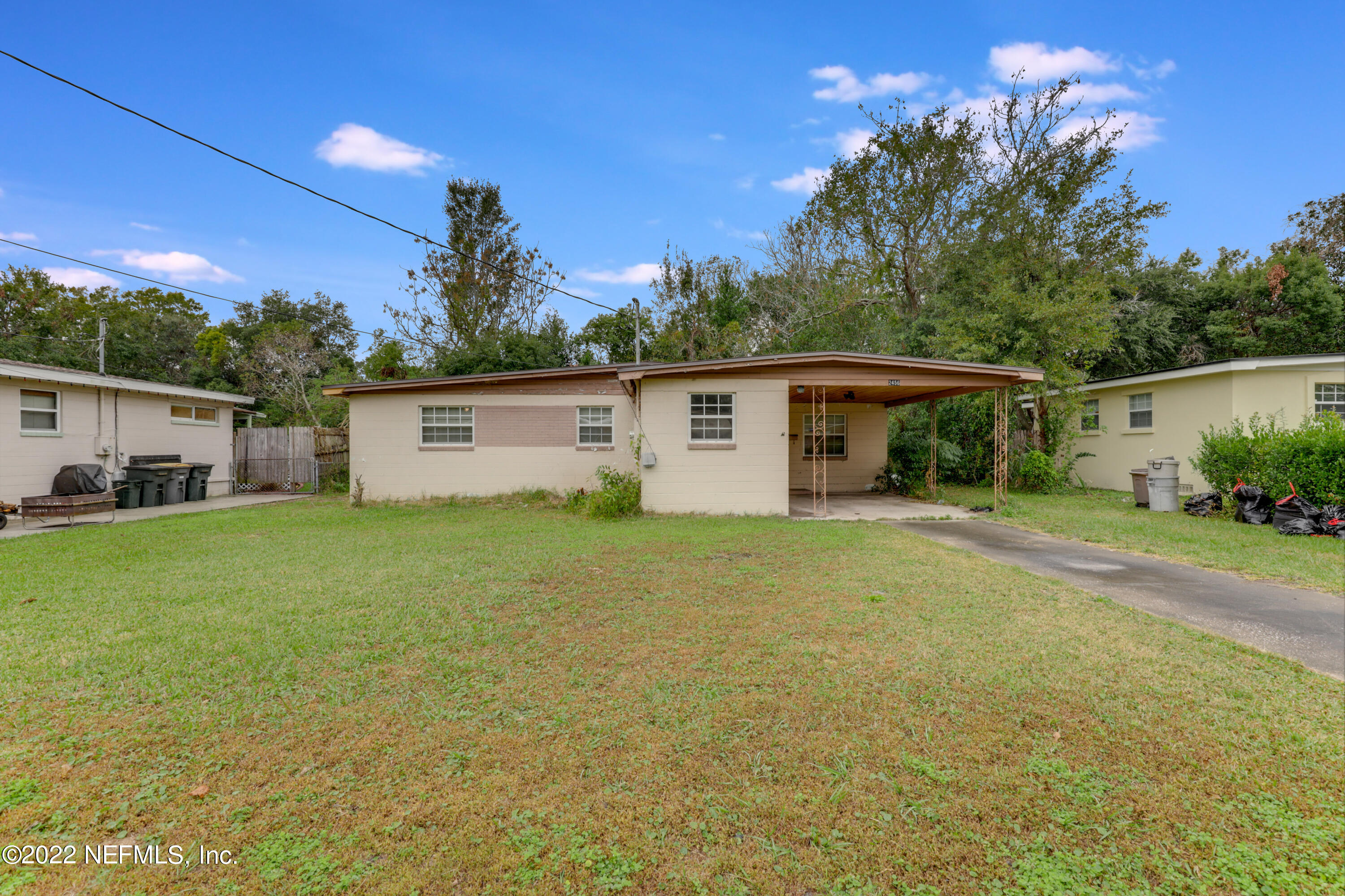 2456 Sam Road Jacksonville, FL 32216 - Photo 5 of 30 a view of a house with backyard and garden