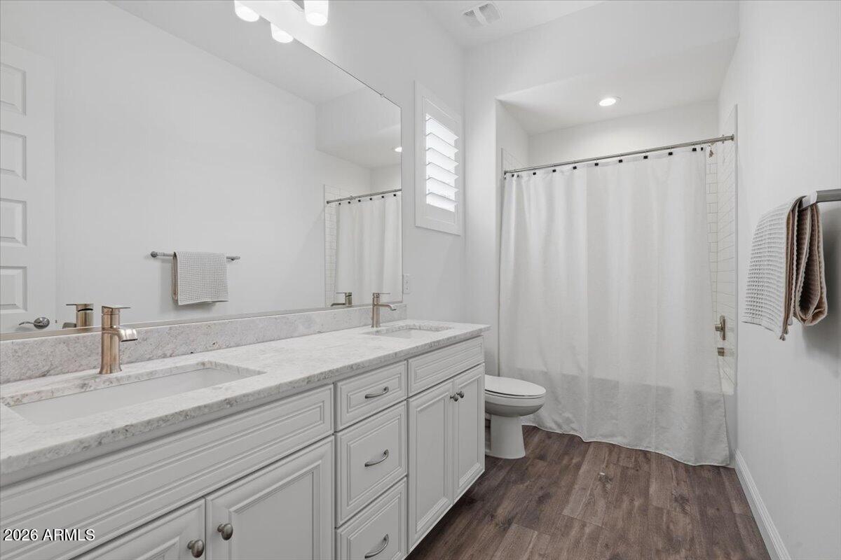 22608 East Stacey Road Queen Creek, AZ 85142 - Photo 9 of 83 a bathroom with a double vanity sink and mirror