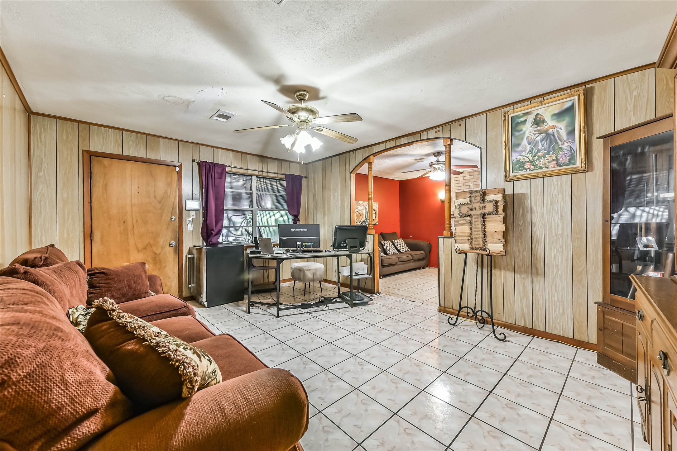 10438 Caxton Street Houston, TX 77016 - Photo 6 of 24 a living room with furniture and a large window
