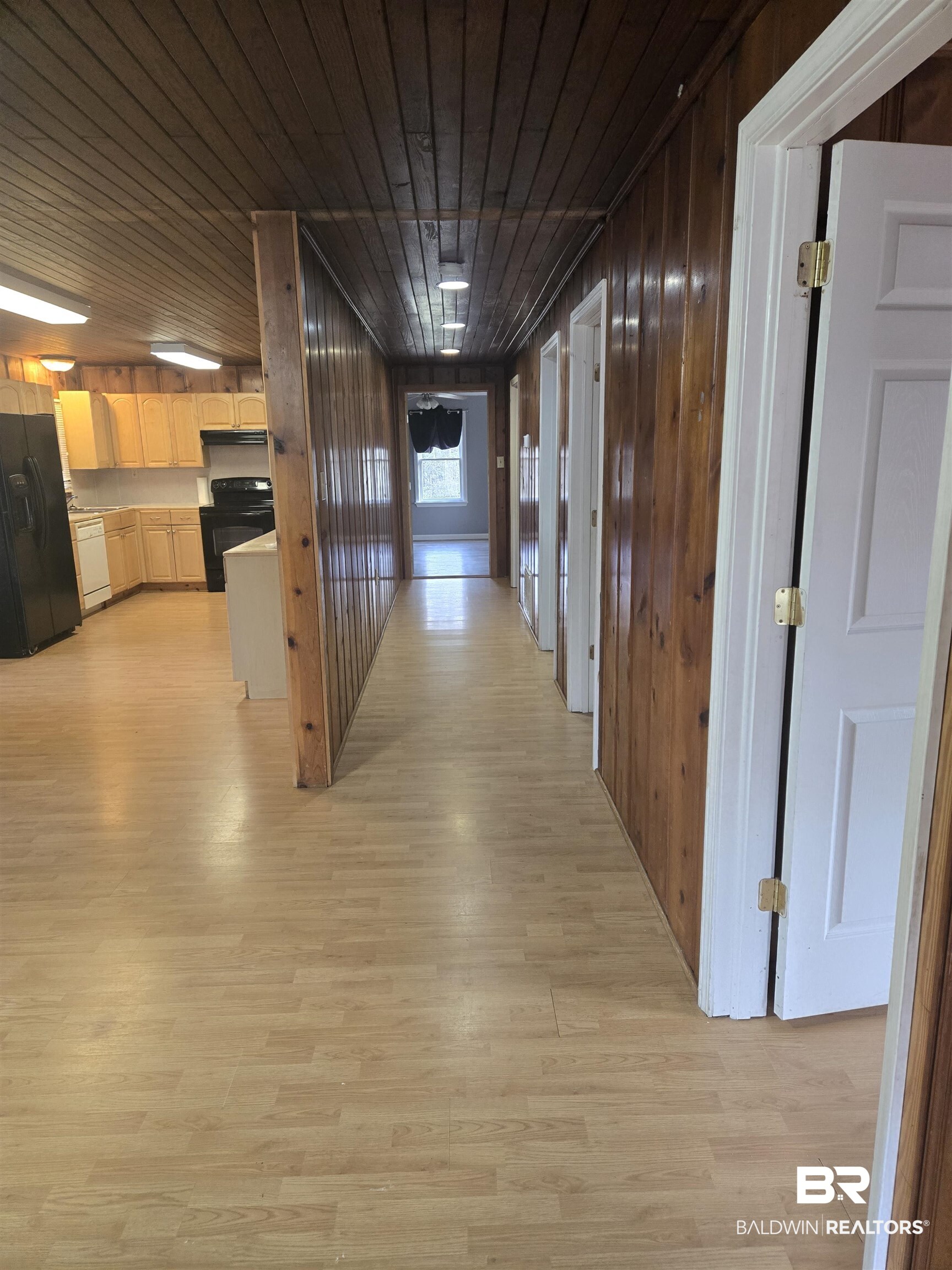 16360 Tolbert Road Bay Minette, AL 36507 - Photo 3 of 14 Hallway featuring light wood-style flooring, wooden ceiling, and wooden walls