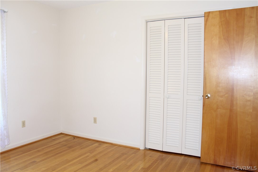 20600 Rowanty Road Carson, VA 23830 - Photo 17 of 25 a view of an empty room with wooden floor