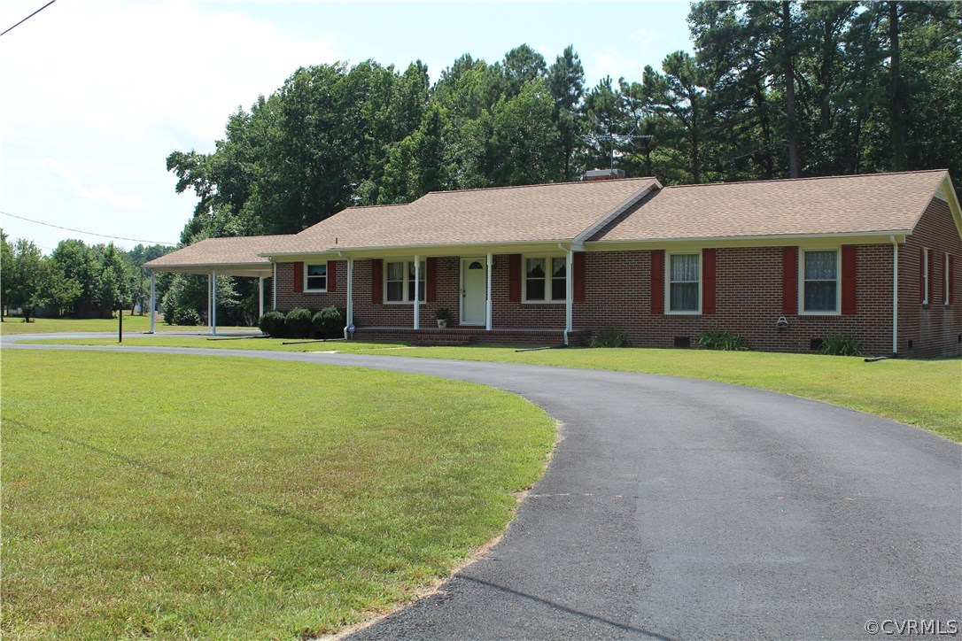 20600 Rowanty Road Carson, VA 23830 - Photo 2 of 25 a view of a house with a garden and trees