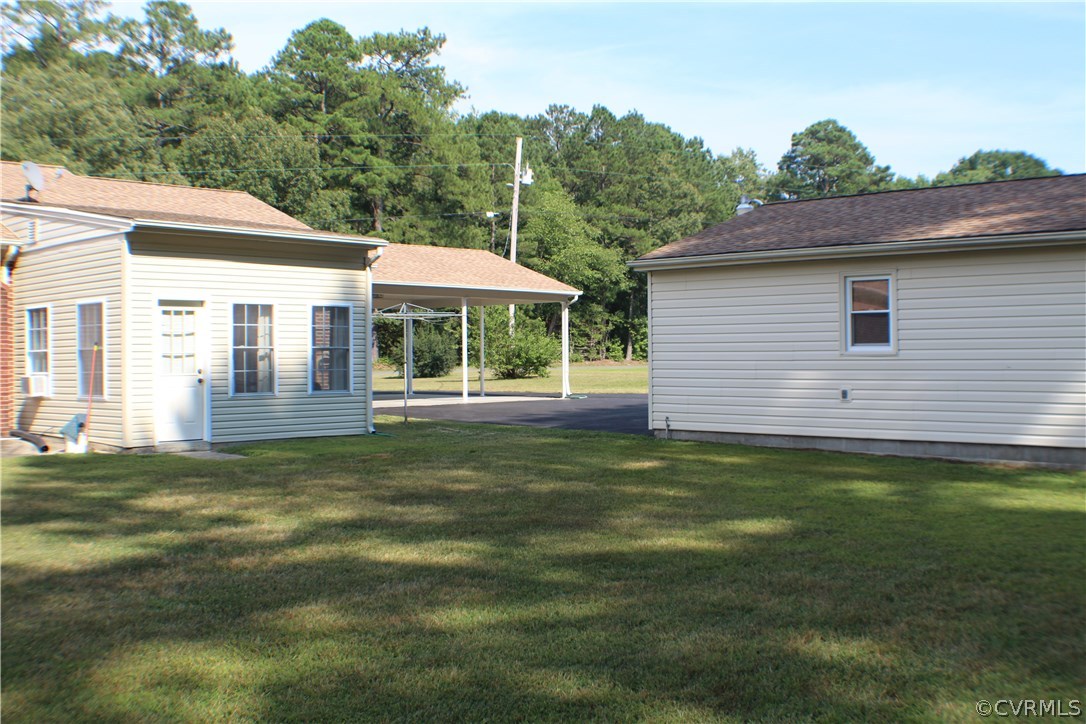 20600 Rowanty Road Carson, VA 23830 - Photo 23 of 25 a backyard of a house with table and chairs