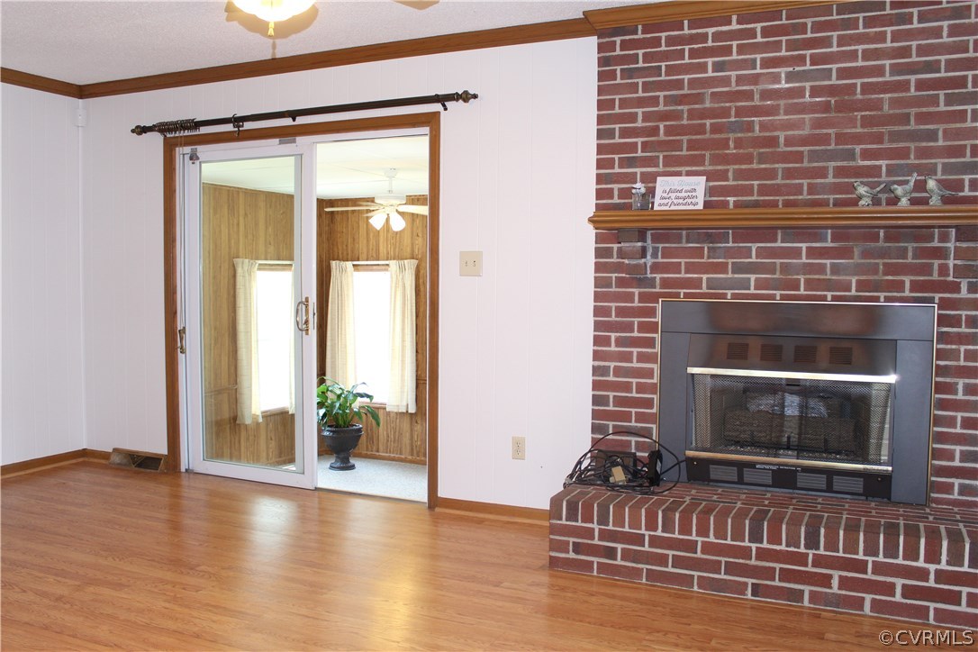 20600 Rowanty Road Carson, VA 23830 - Photo 4 of 25 a living room with furniture and a fireplace