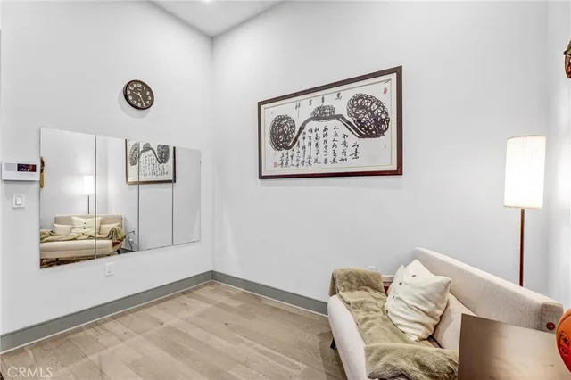 a view of a livingroom with furniture and a window