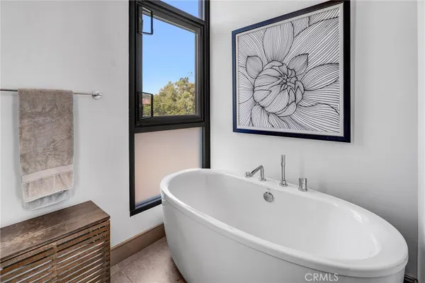 a spacious bathroom with a double vanity sink mirror and toilet