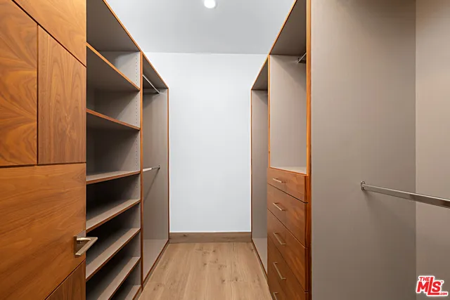 a bathroom with a sink toilet vanity and shower