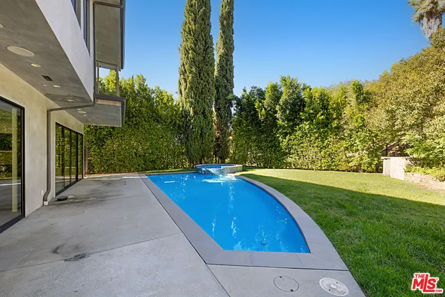 a view of swimming pool with outdoor seating