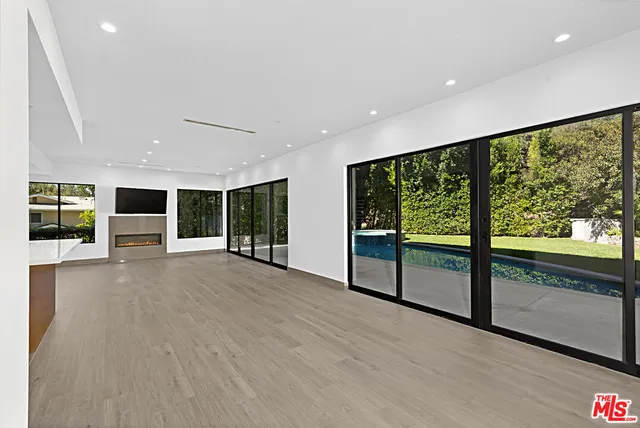 a view of an empty room with a large window