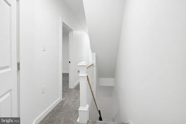 a view of a hallway with stairs