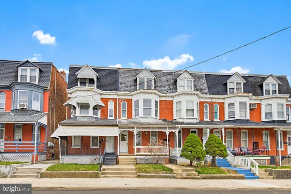 a front view of residential houses with street