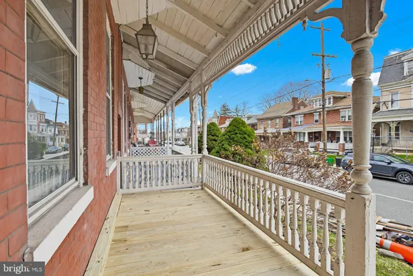 a view of a porch with wooden floor
