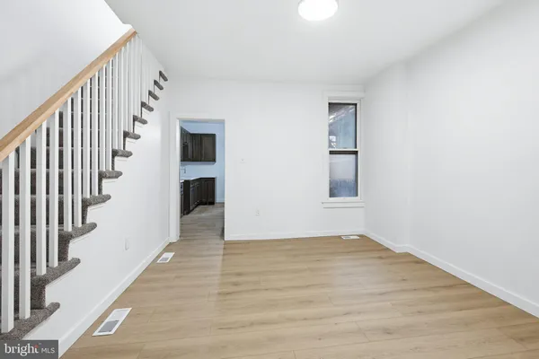a view of an entryway with wooden floor