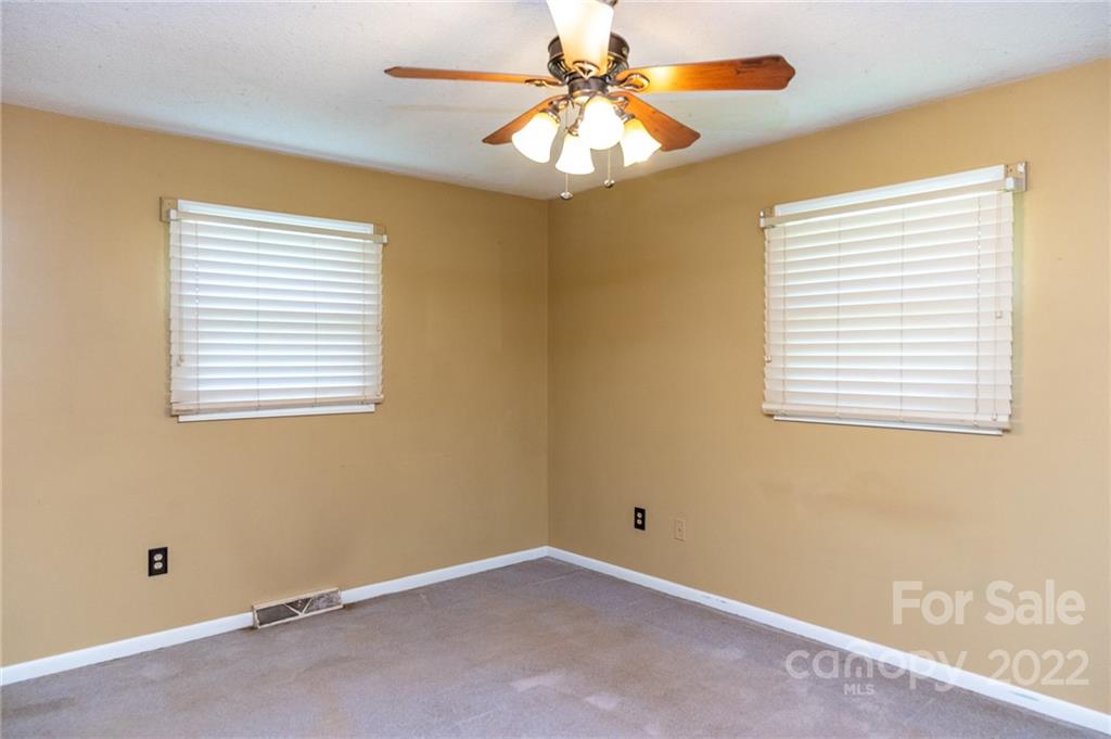 9201 Phelps Road Mount Pleasant, NC 28124 - Photo 10 of 24 a view of an empty room with a window