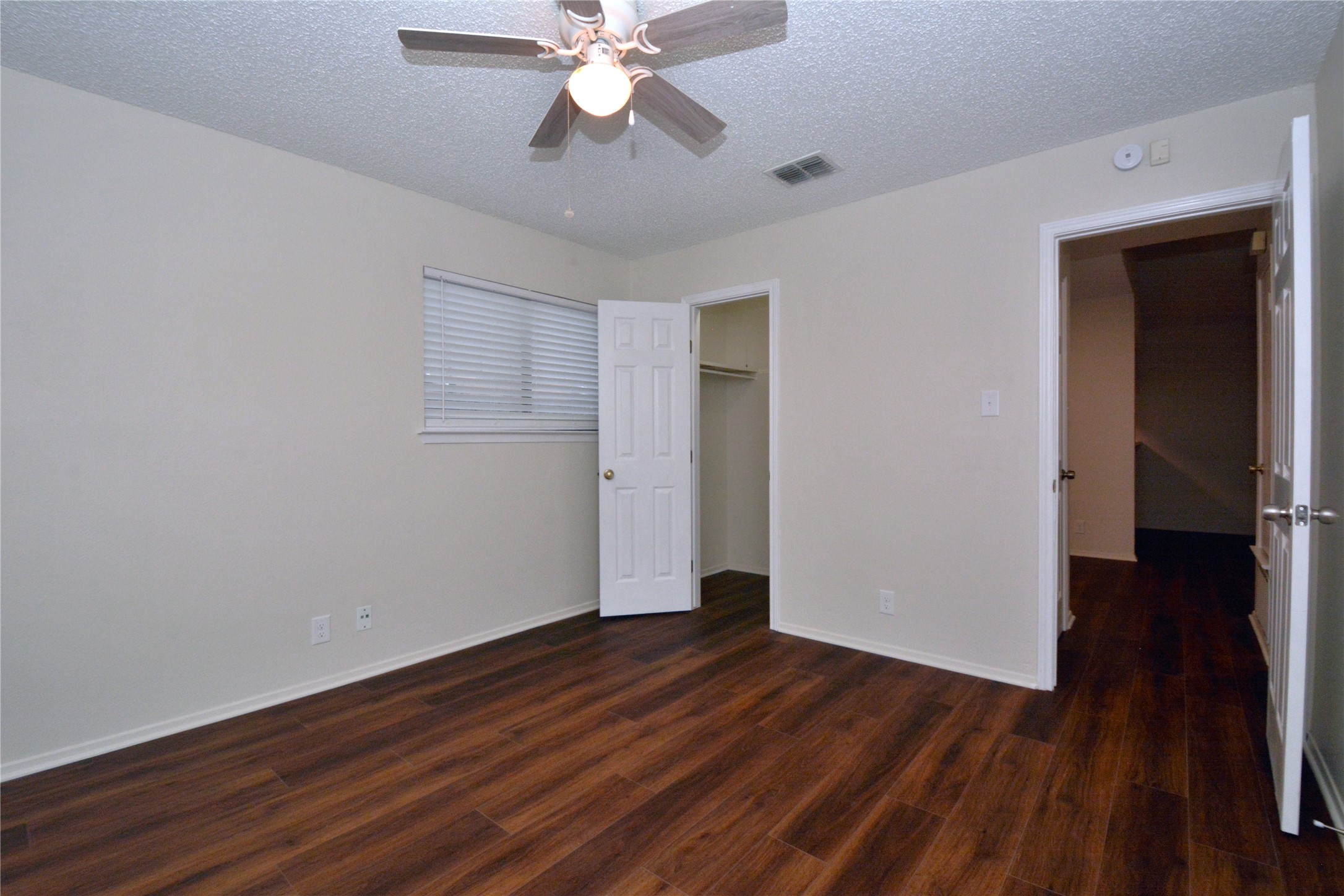 11314 Walnut Ridge Drive, Unit B Austin, TX 78753 - Photo 16 of 19 Refined wood-look flooring enhances this generously sized sleeping quarter.