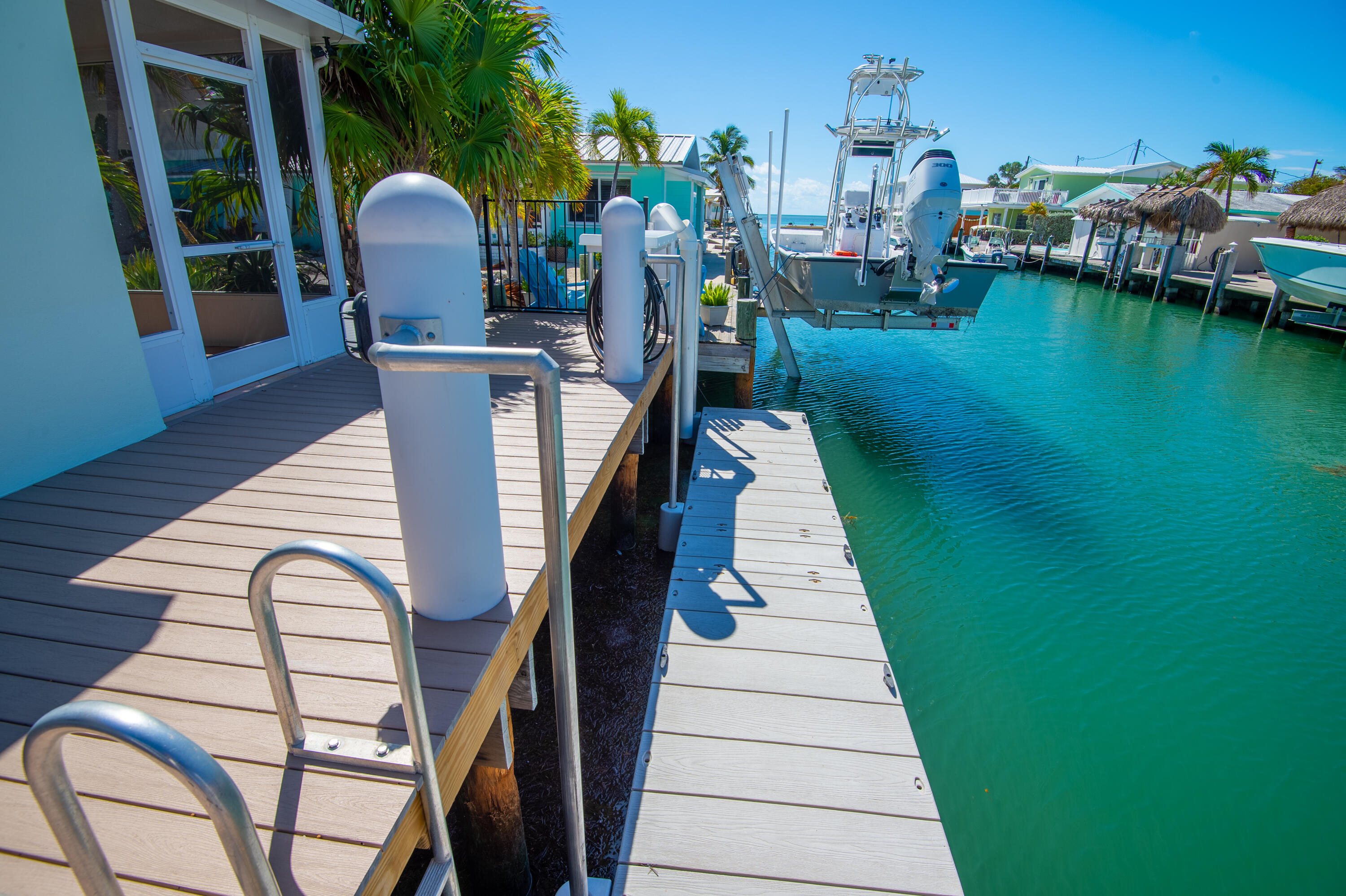 11322 3rd Avenue Marathon, FL 33050 - Photo 15 of 39 a view of a chairs and table in patio with swimming pool