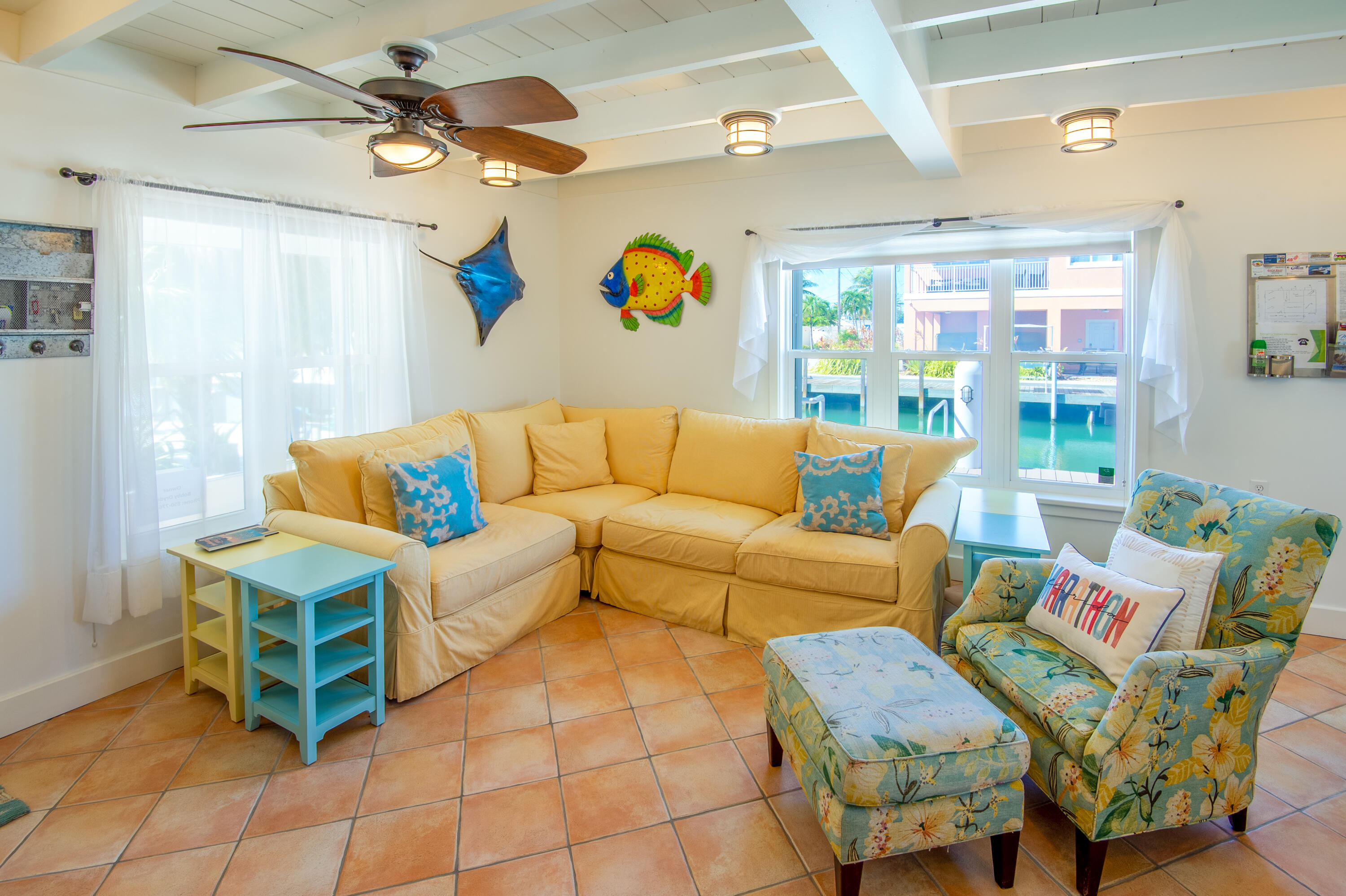 11322 3rd Avenue Marathon, FL 33050 - Photo 16 of 39 a living room with furniture and a chandelier