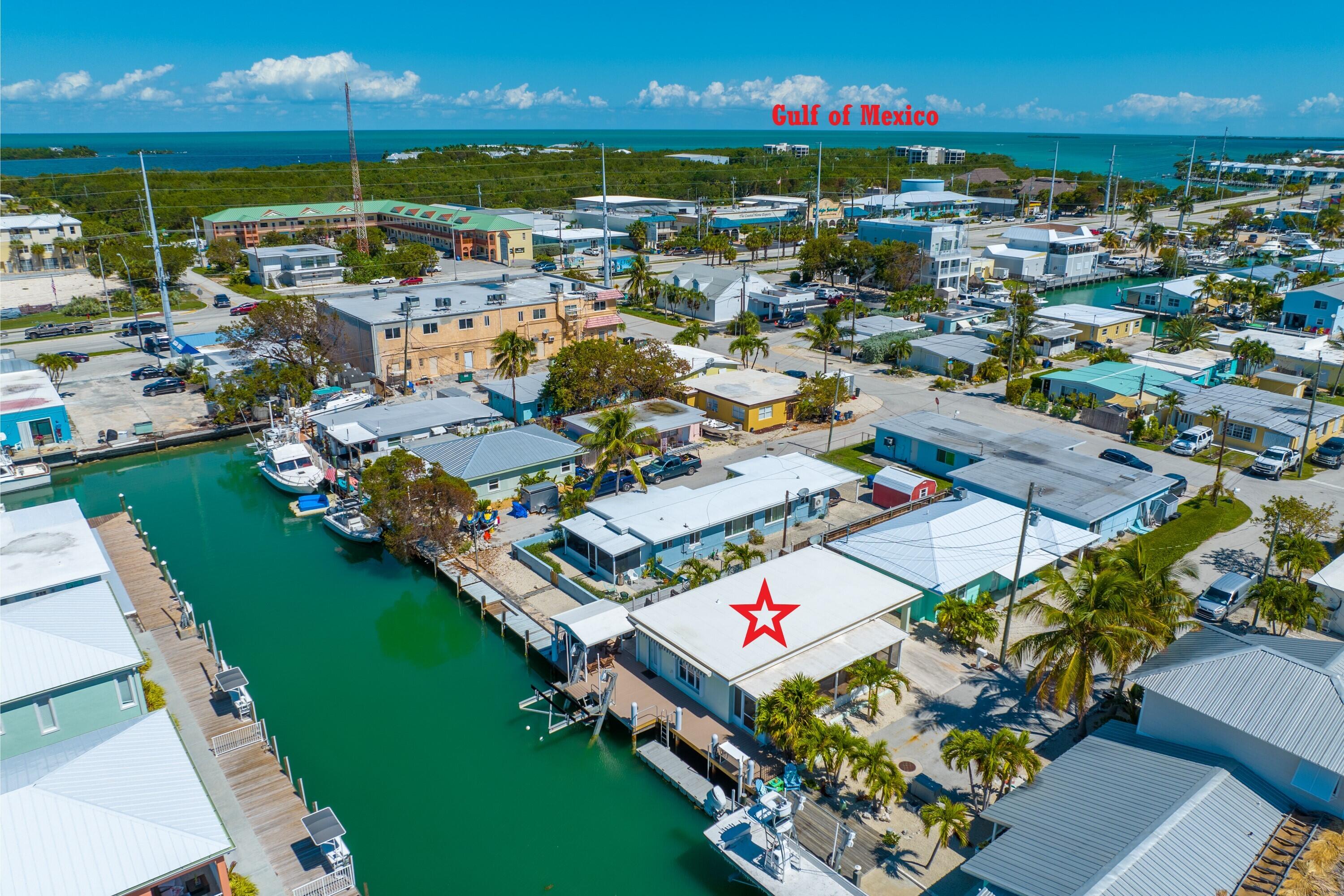 11322 3rd Avenue Marathon, FL 33050 - Photo 38 of 39 an aerial view of residential houses with outdoor space and swimming pool