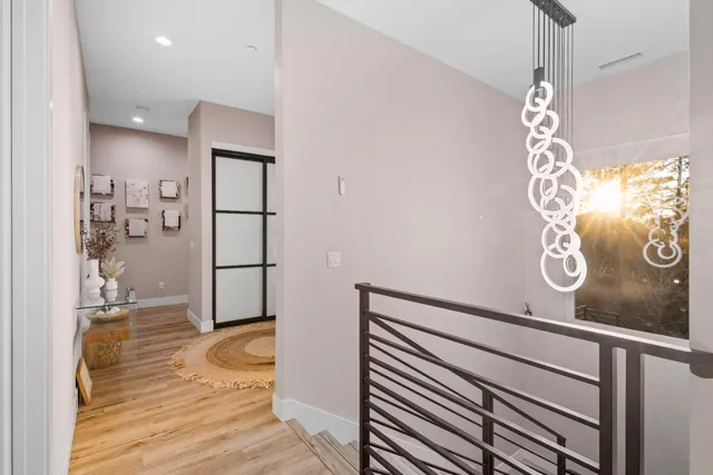 a bathroom with a granite countertop sink a toilet and mirror
