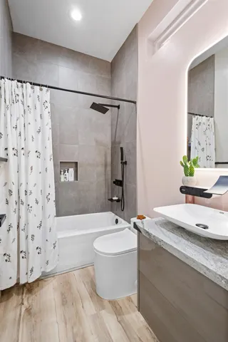 a room with furniture and a wooden floor