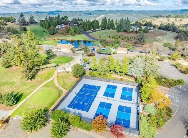 a living room with furniture flat screen tv and couches
