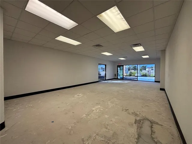 a front view of a building with parking