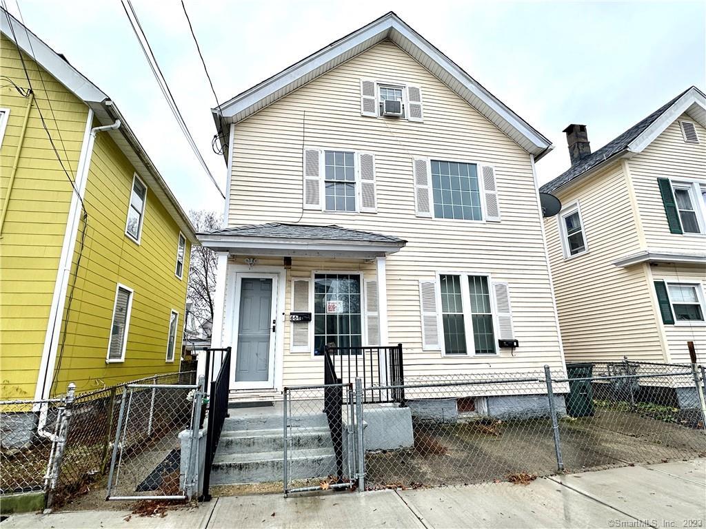 666 Ogden Street Bridgeport, CT 06608 - Photo 1 of 1 a front view of a house with a porch