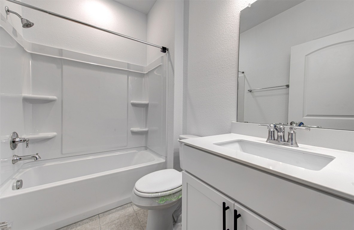 169 Slenderleaf Drive Marble Falls, TX 78654 - Photo 13 of 24 a bathroom with a granite countertop sink toilet and shower