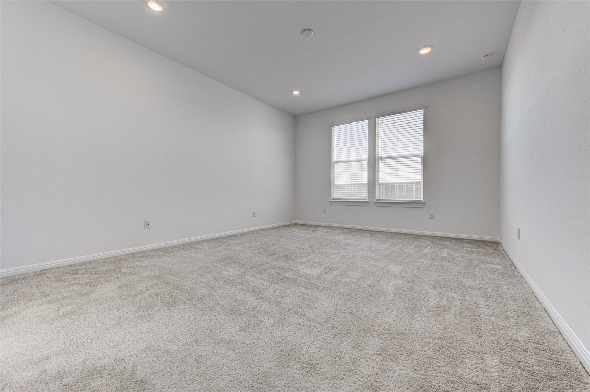 169 Slenderleaf Drive Marble Falls, TX 78654 - Photo 14 of 24 en empty room with windows