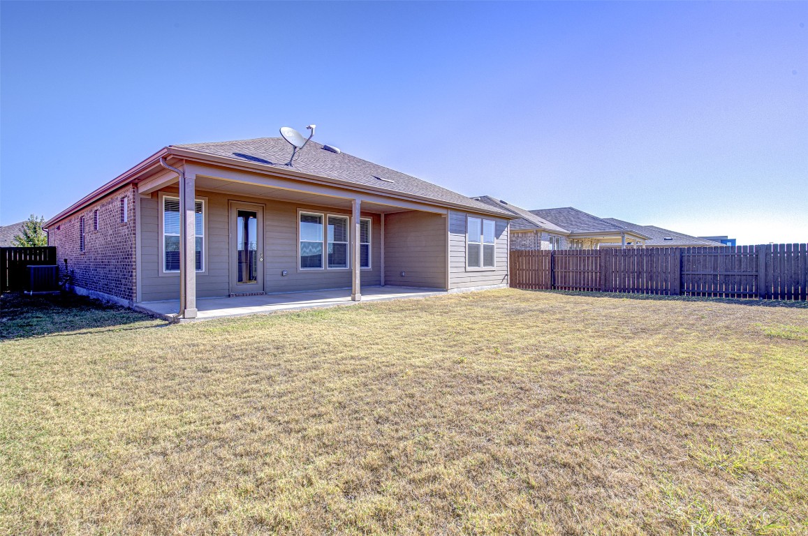 169 Slenderleaf Drive Marble Falls, TX 78654 - Photo 22 of 24 a front view of a house with a yard