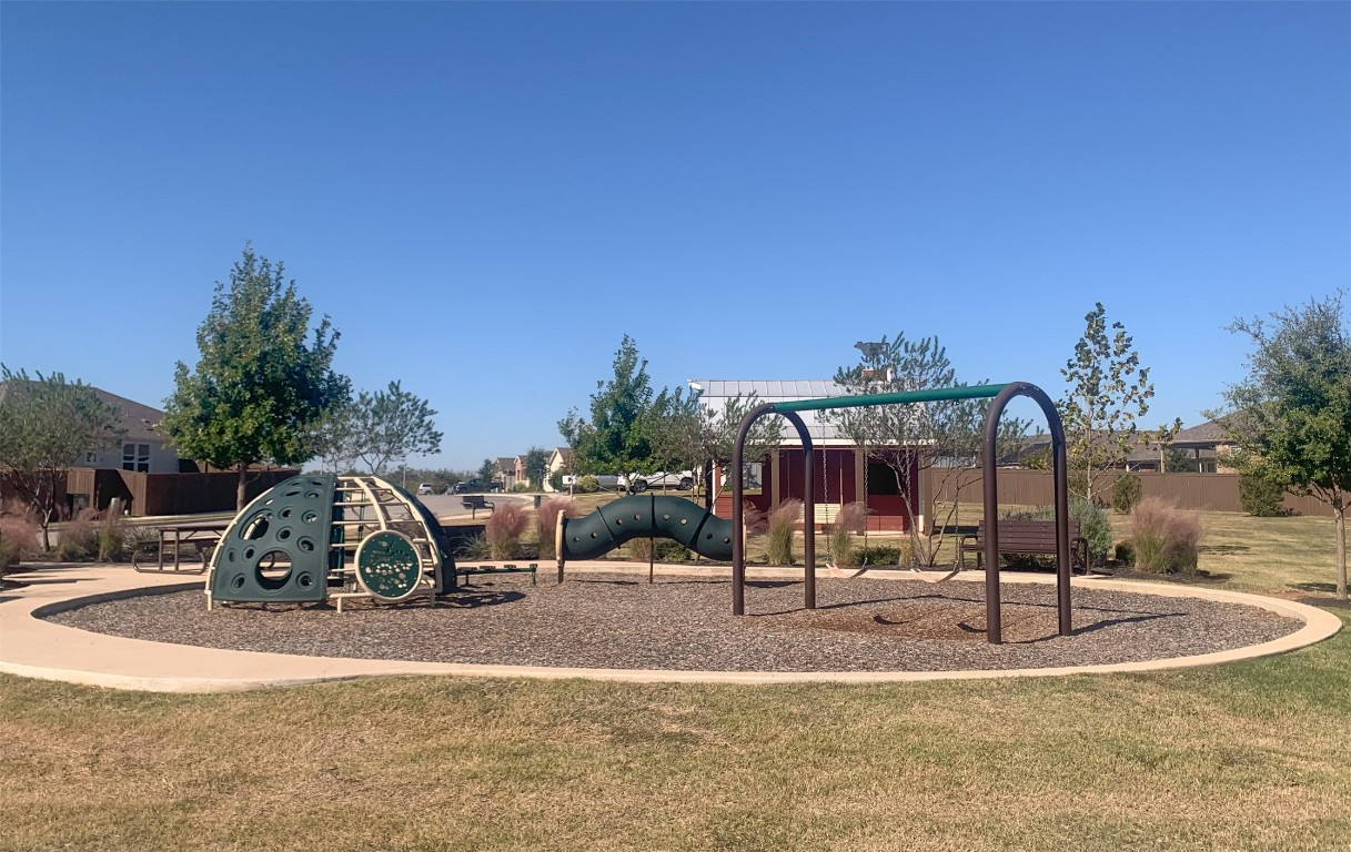 169 Slenderleaf Drive Marble Falls, TX 78654 - Photo 24 of 24 a view of a palm tree with an house