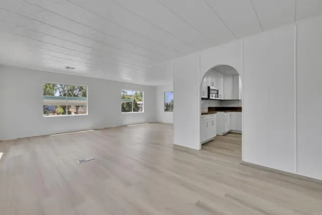 a kitchen with a sink cabinets and window