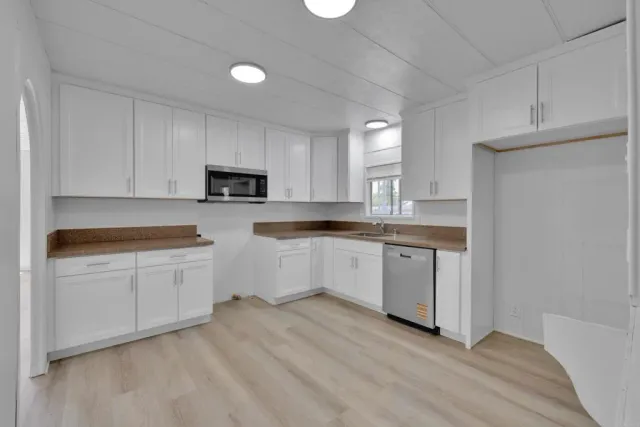 a view of kitchen with wooden floor