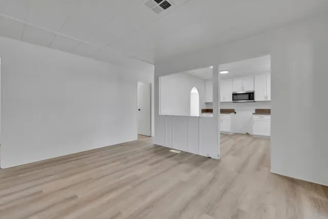 a view of cabinets with wooden floor