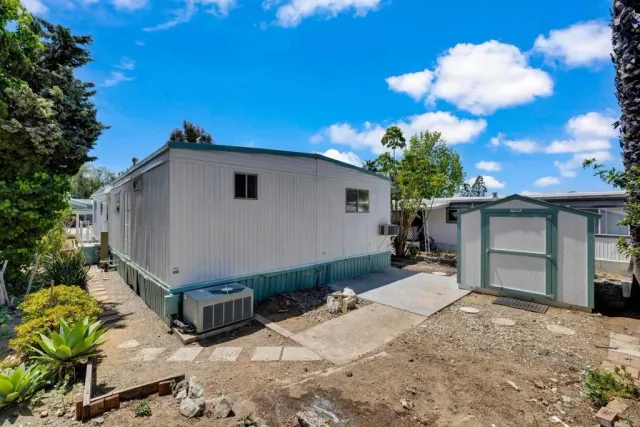 a view of a house with a small yard