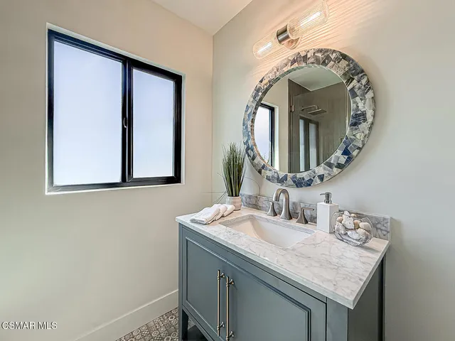 a bedroom with a large bed and a couch