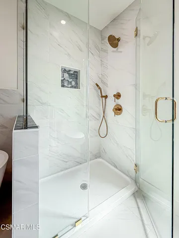 a white bath tub sitting in a bathroom