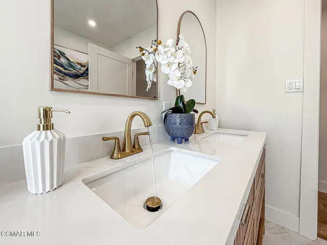 a view of a house with pool and chairs
