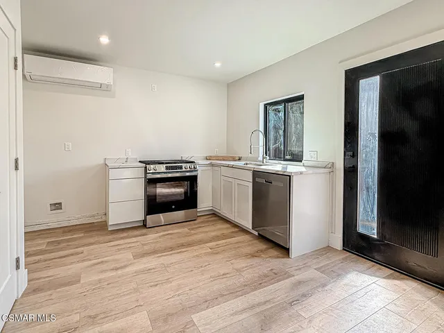 a bathroom with a shower a toilet and sink
