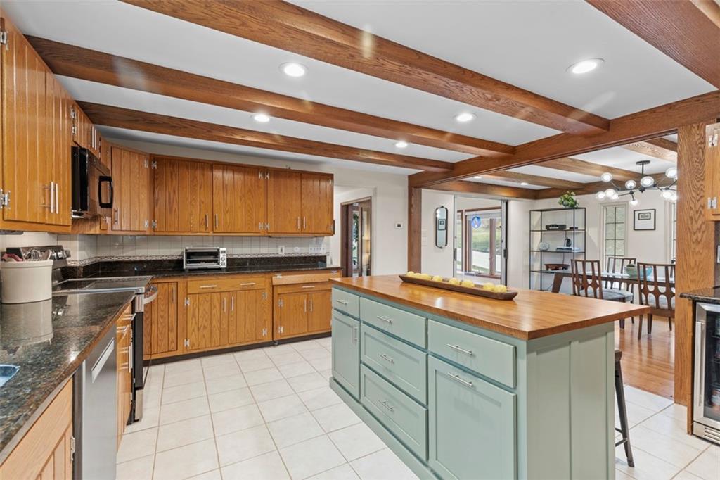 85 Lambeth Drive Pittsburgh, PA 15241 - Photo 11 of 47 a kitchen with stainless steel appliances granite countertop a sink and cabinets