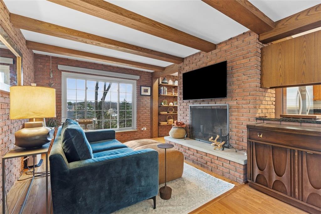 85 Lambeth Drive Pittsburgh, PA 15241 - Photo 15 of 47 a living room with fireplace furniture and a flat screen tv