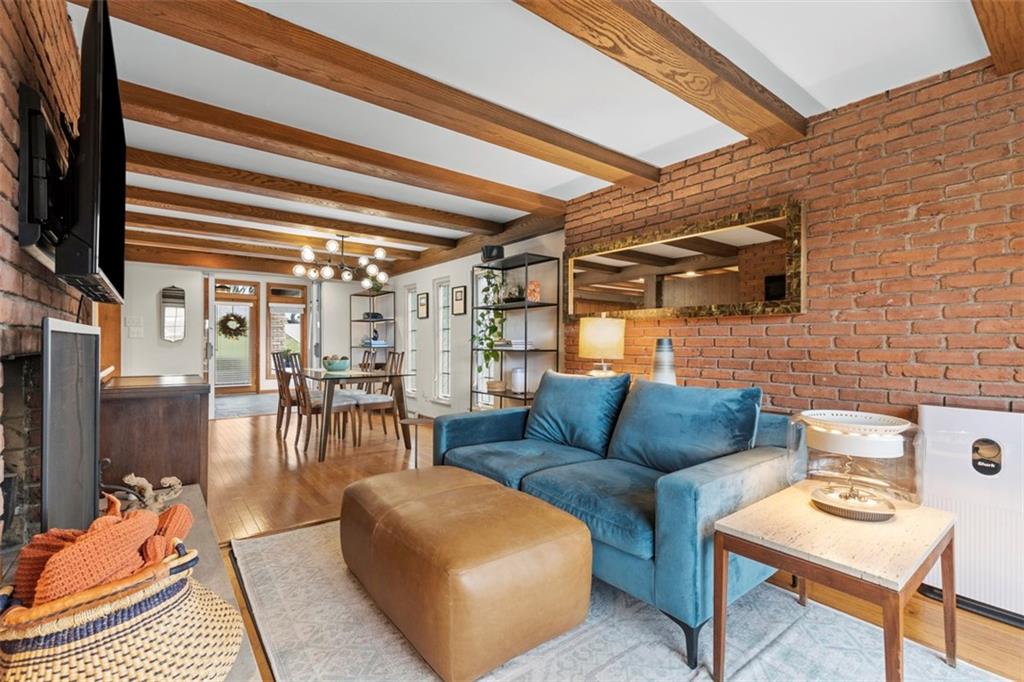 85 Lambeth Drive Pittsburgh, PA 15241 - Photo 16 of 47 a living room with furniture a rug and a chandelier
