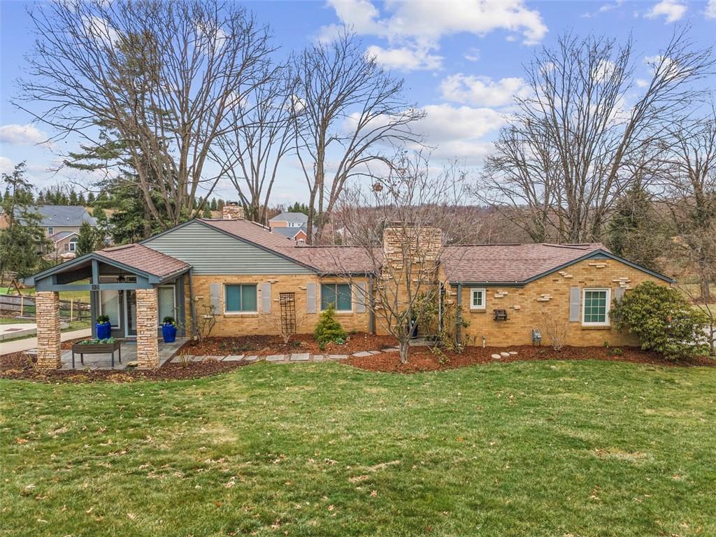 85 Lambeth Drive Pittsburgh, PA 15241 - Photo 2 of 47 a front view of a house with a yard fountain and large tree
